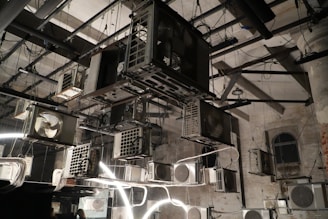 Multiple air conditioning units hanging indoors