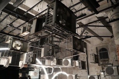 Multiple air conditioning units hanging indoors