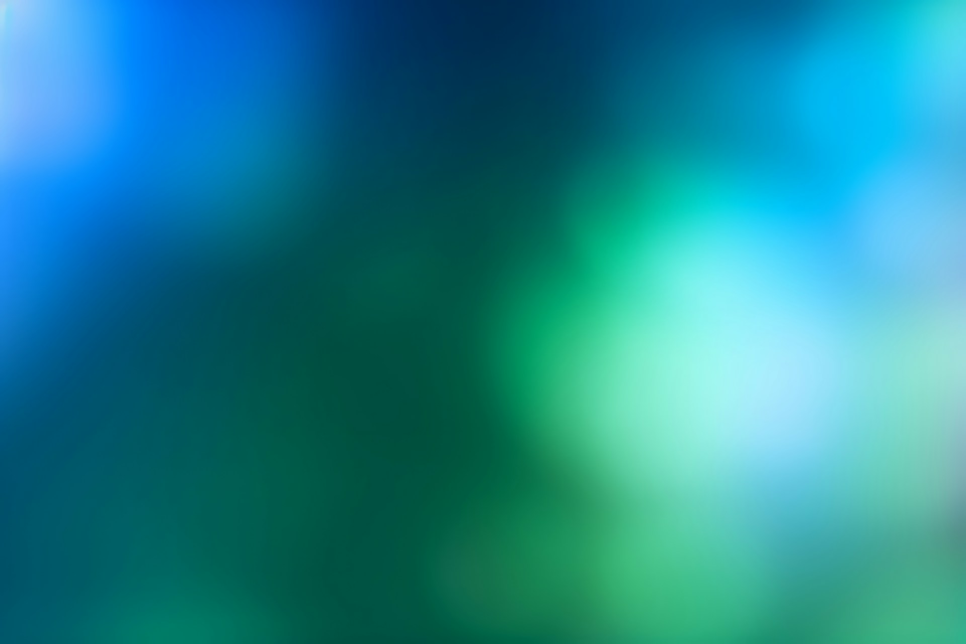 Abstract blue and green bokeh lights background