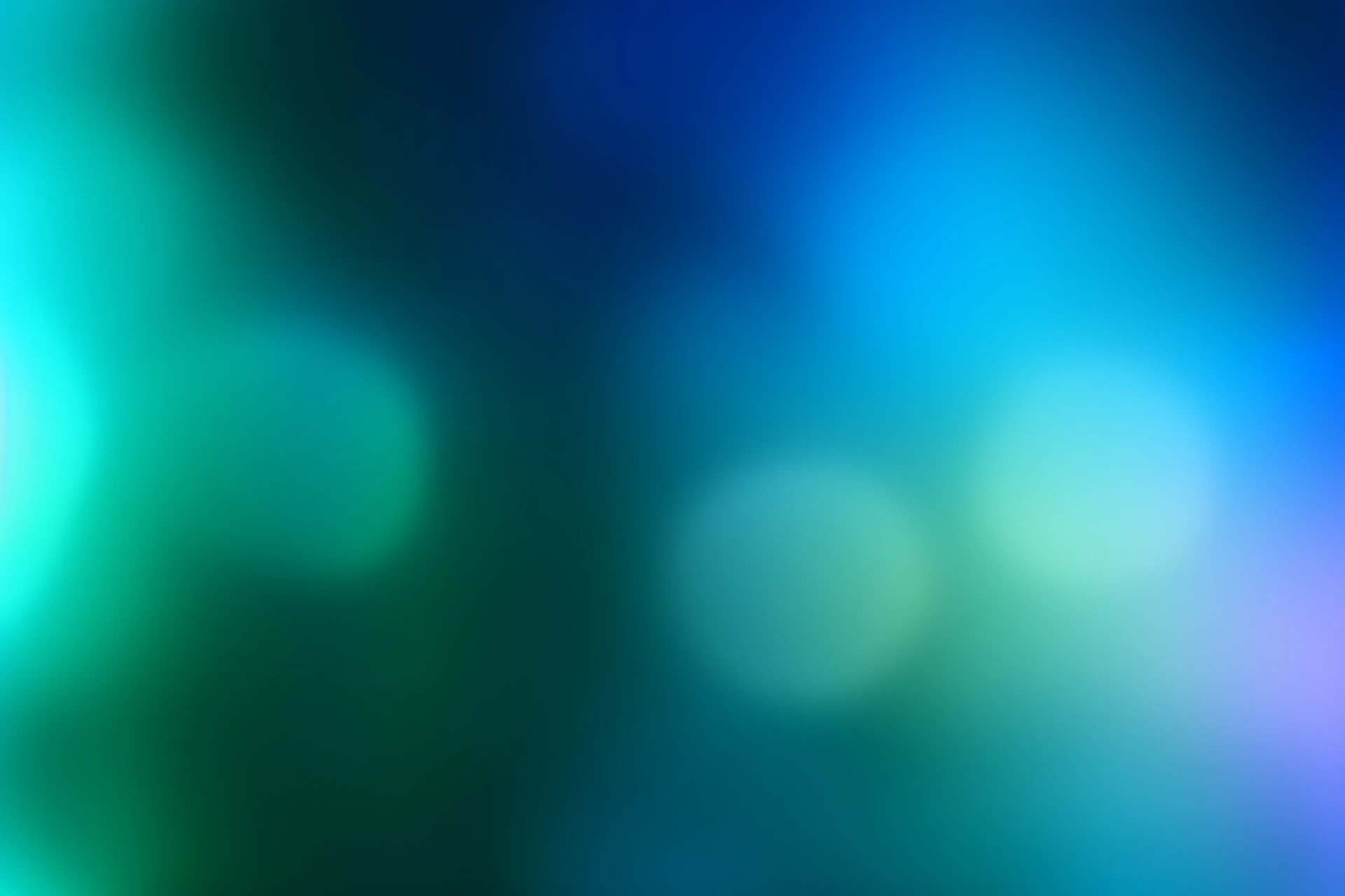 Abstract blue and green bokeh lights background