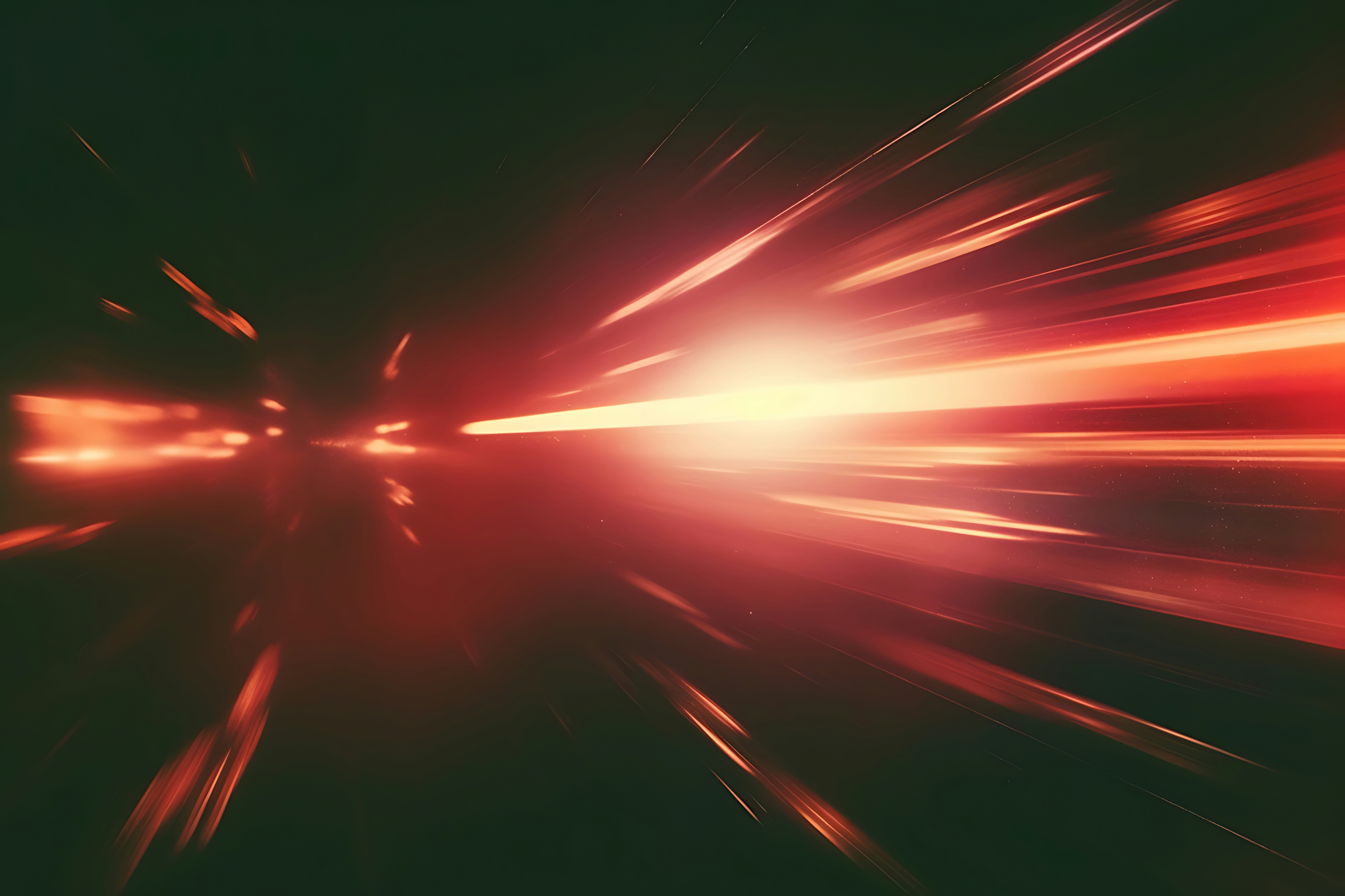 Abstract streaks of red light zoom forward