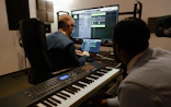 Two men working in a music studio