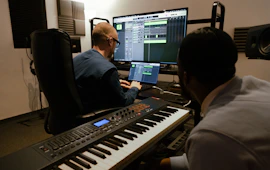 Two men working in a music studio