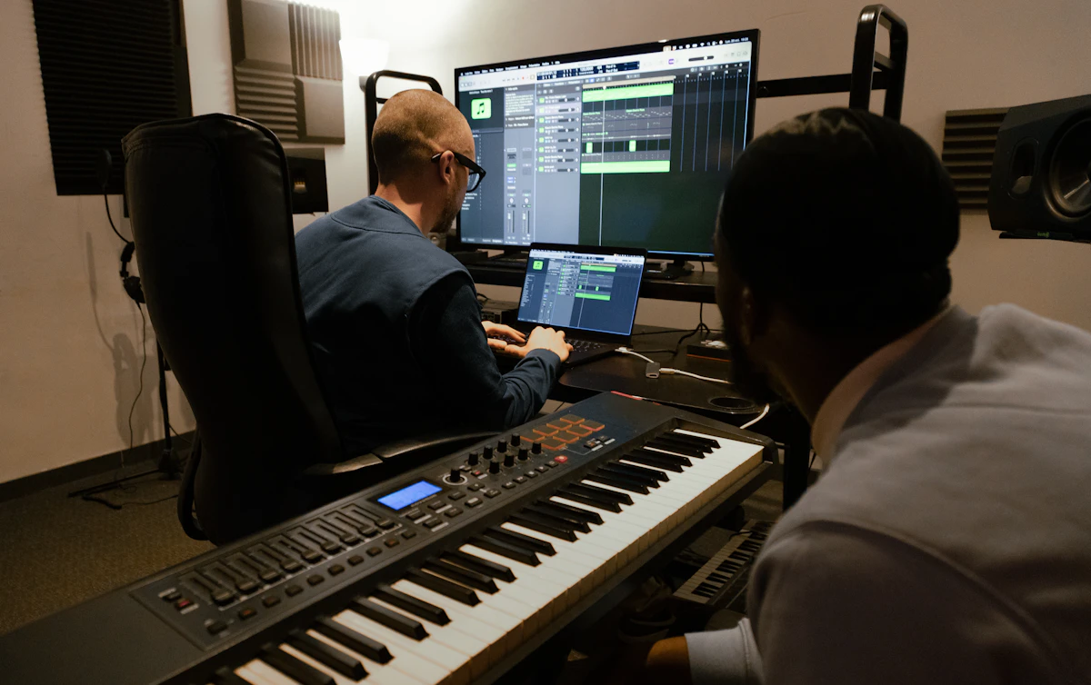 Two music professionals working in a recording studio