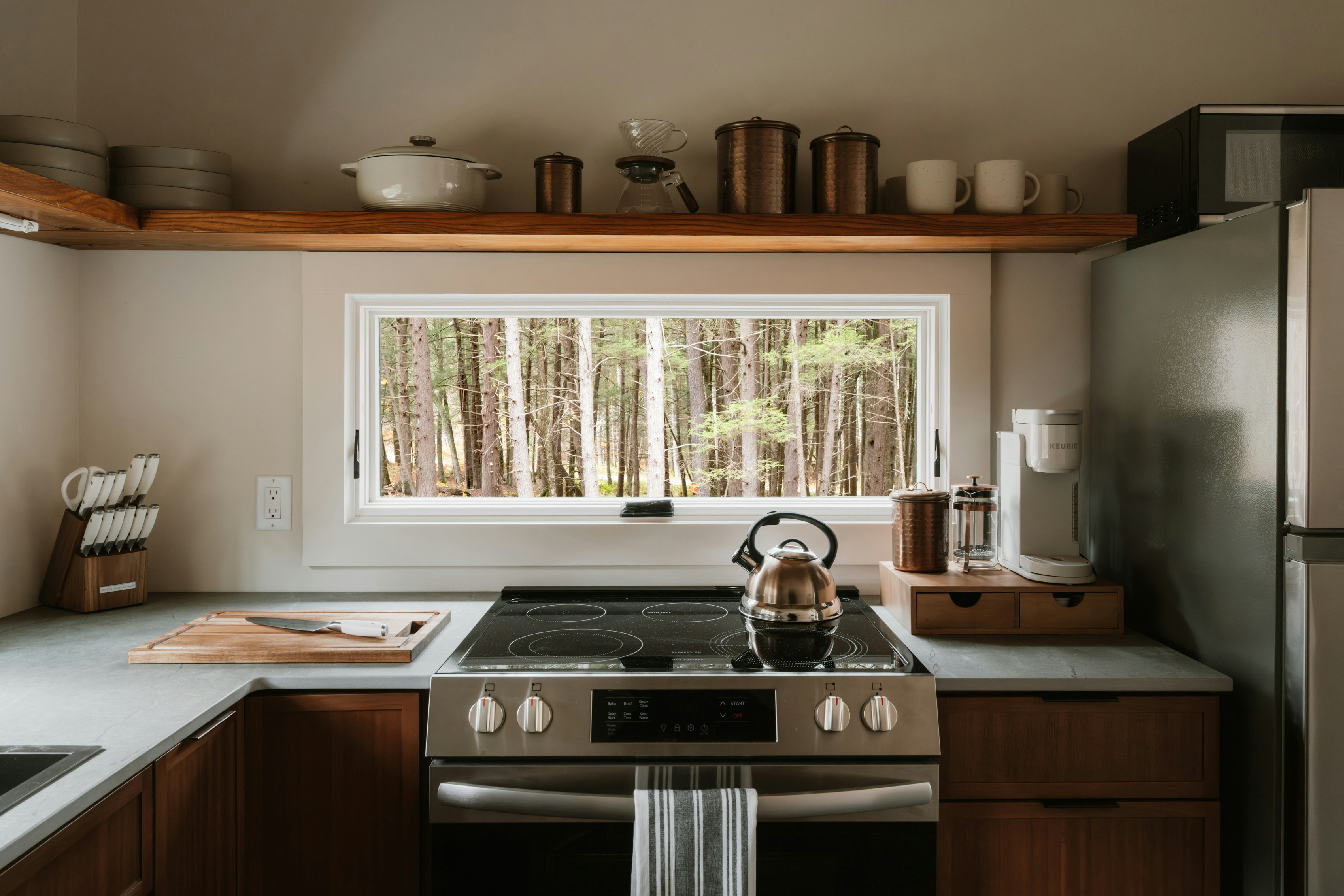Modern kitchen with a view of a forest