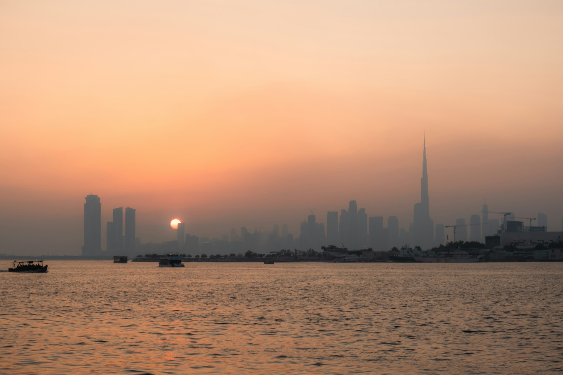 City skyline at sunset over the water