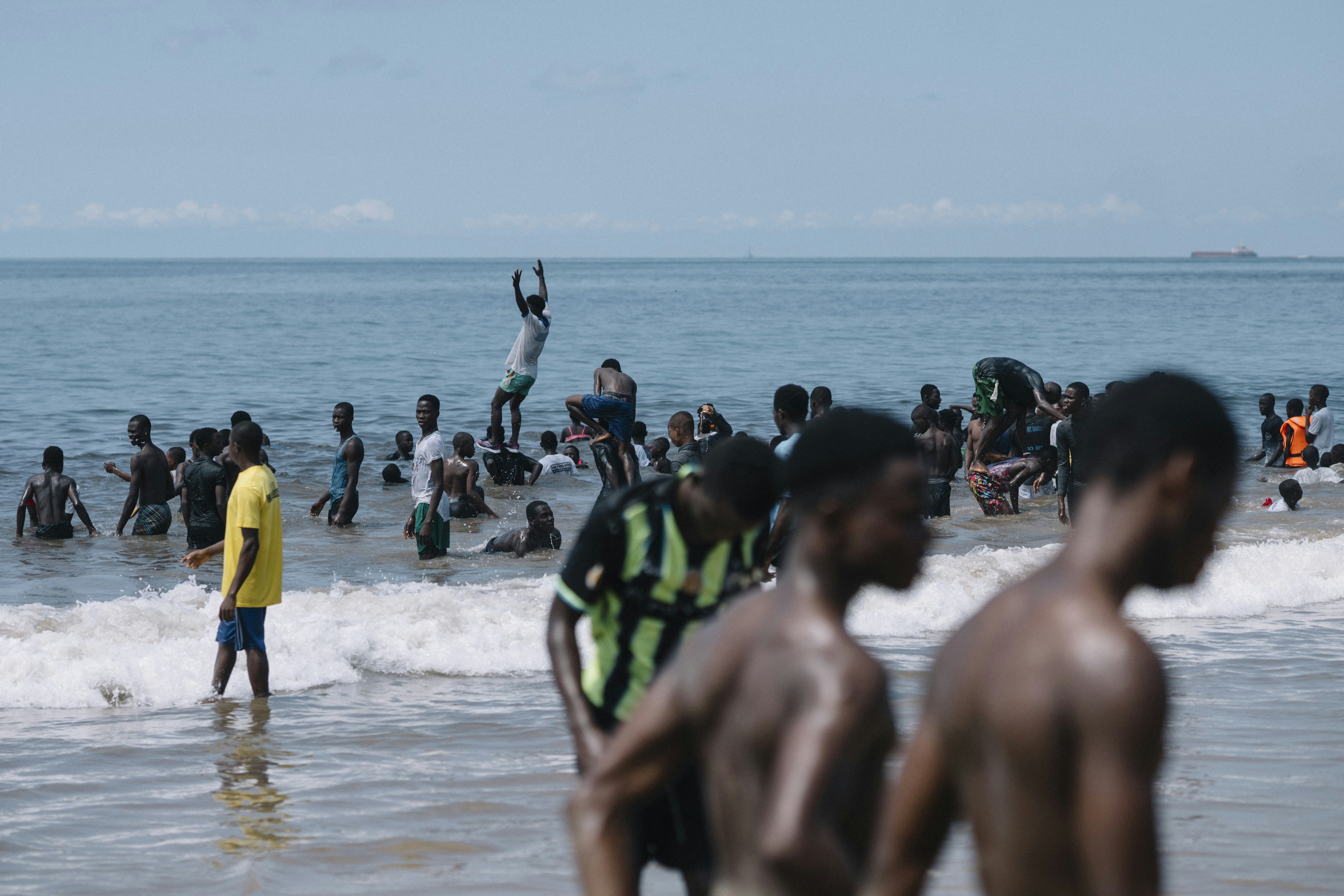People swimming in ocean waves