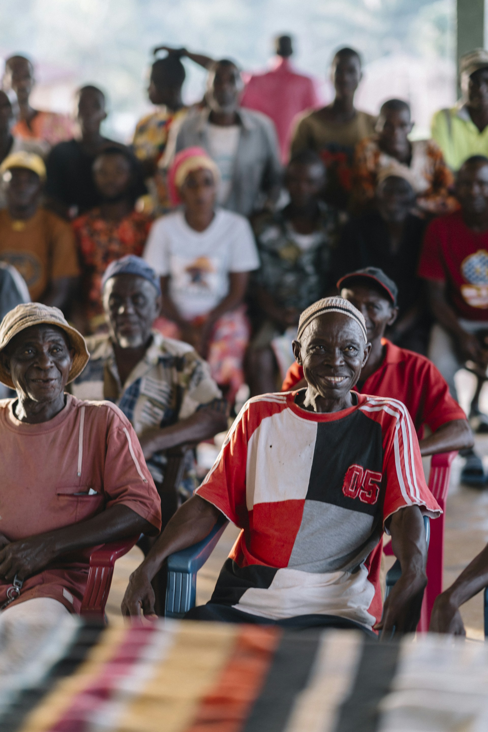 Elderly people gathered together, smiling