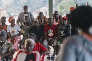 A group of people sitting and watching something.