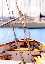 Sailing boats moored in a bright blue harbor