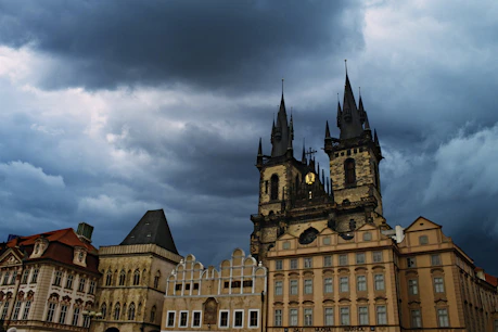 Gothic church spires against stormy sky