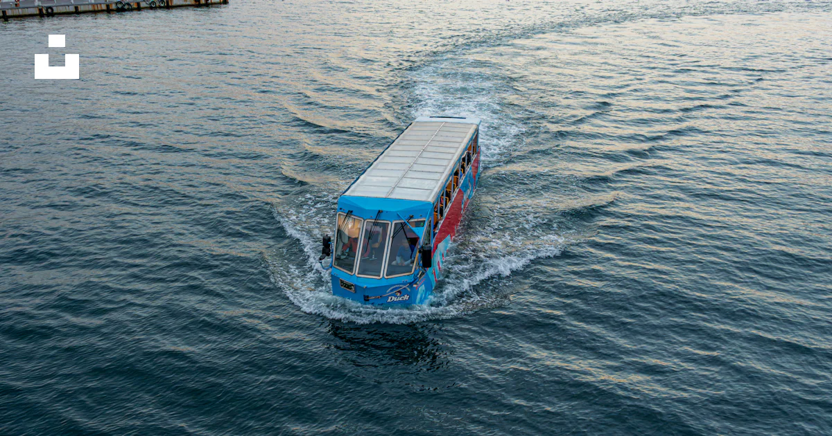 Floating Blue Bus Amphibious bus driving through the water photo β Free Travel Image on ...