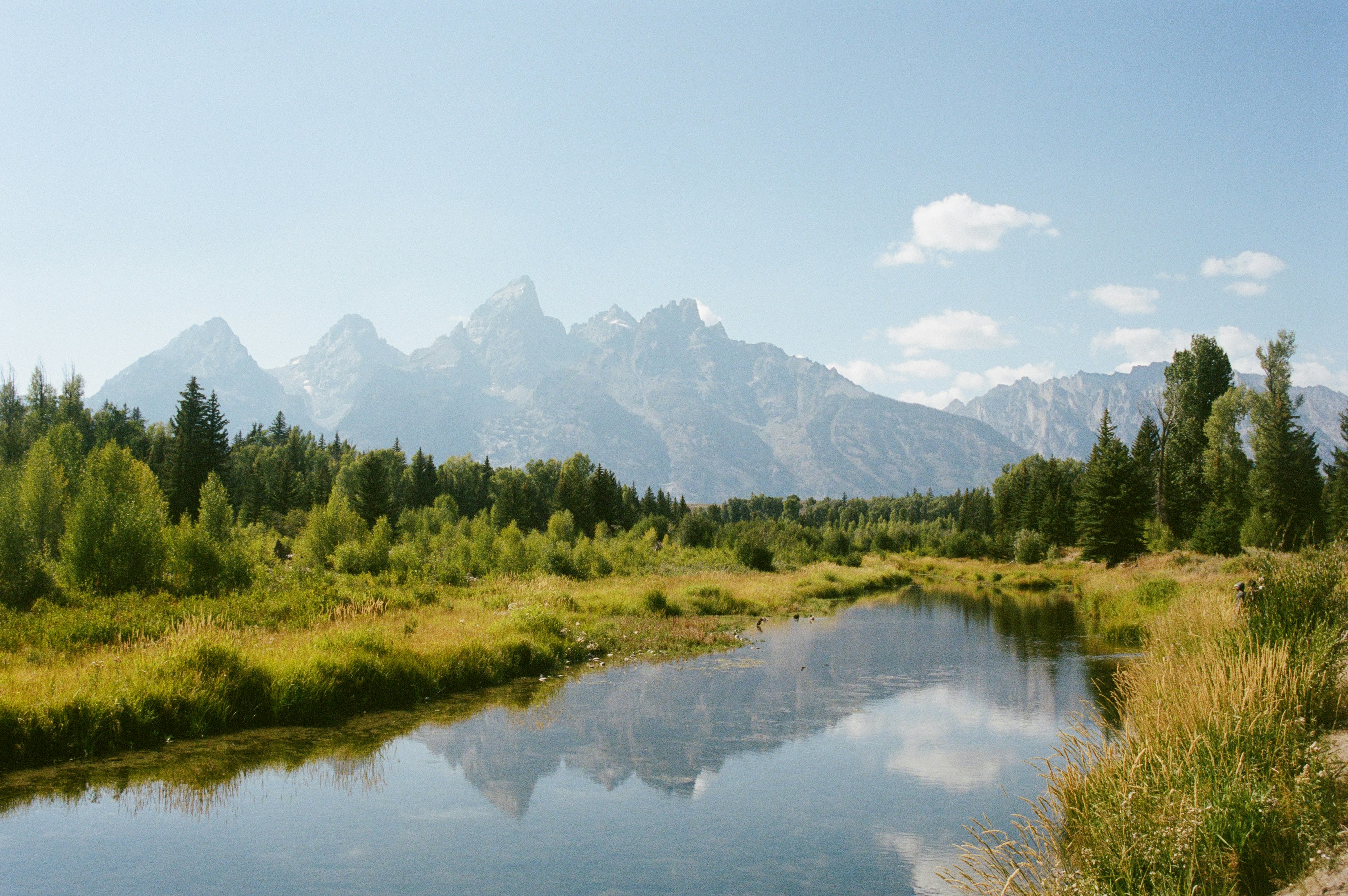 Mountain range reflected in a calm river