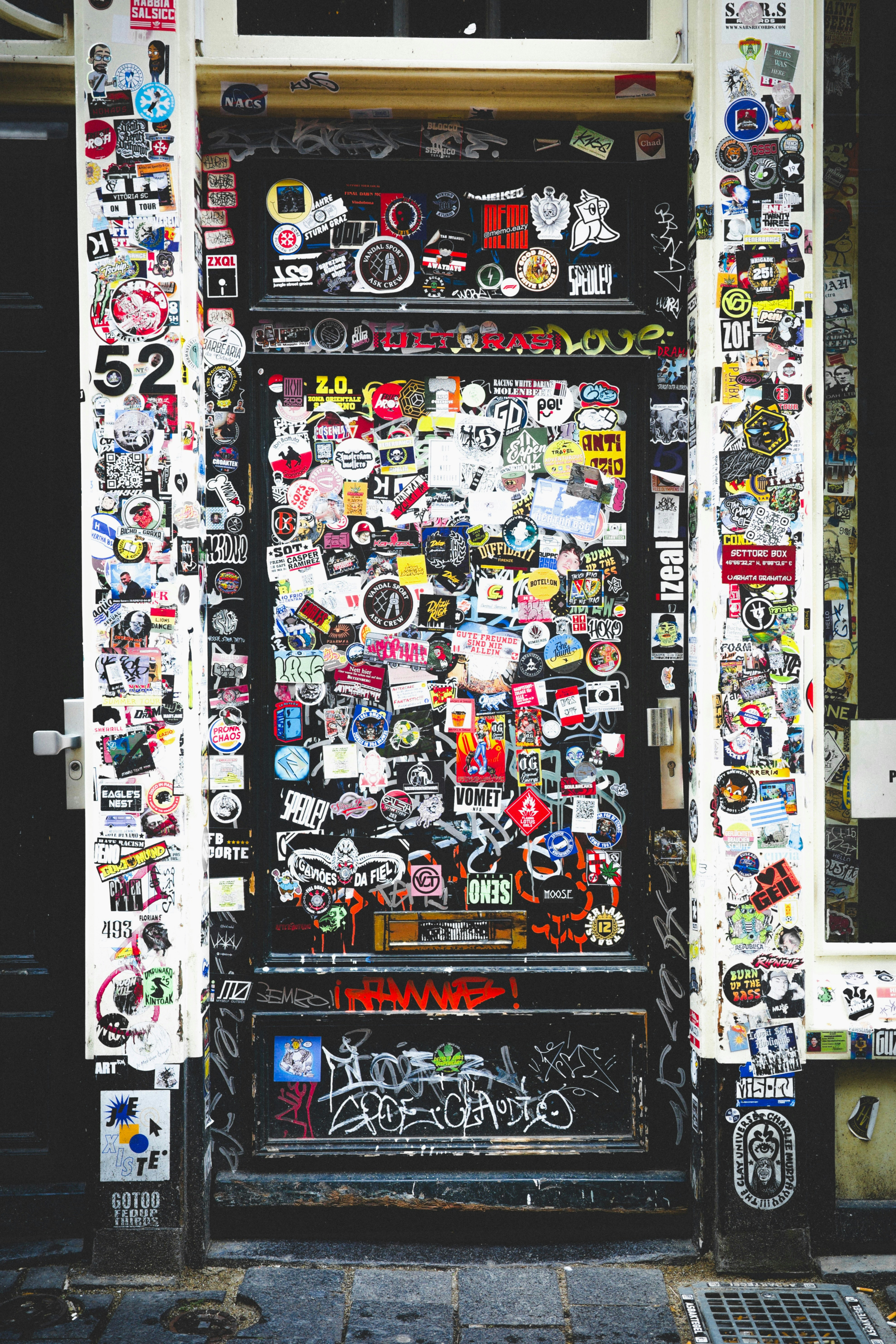 Door covered in stickers and graffiti