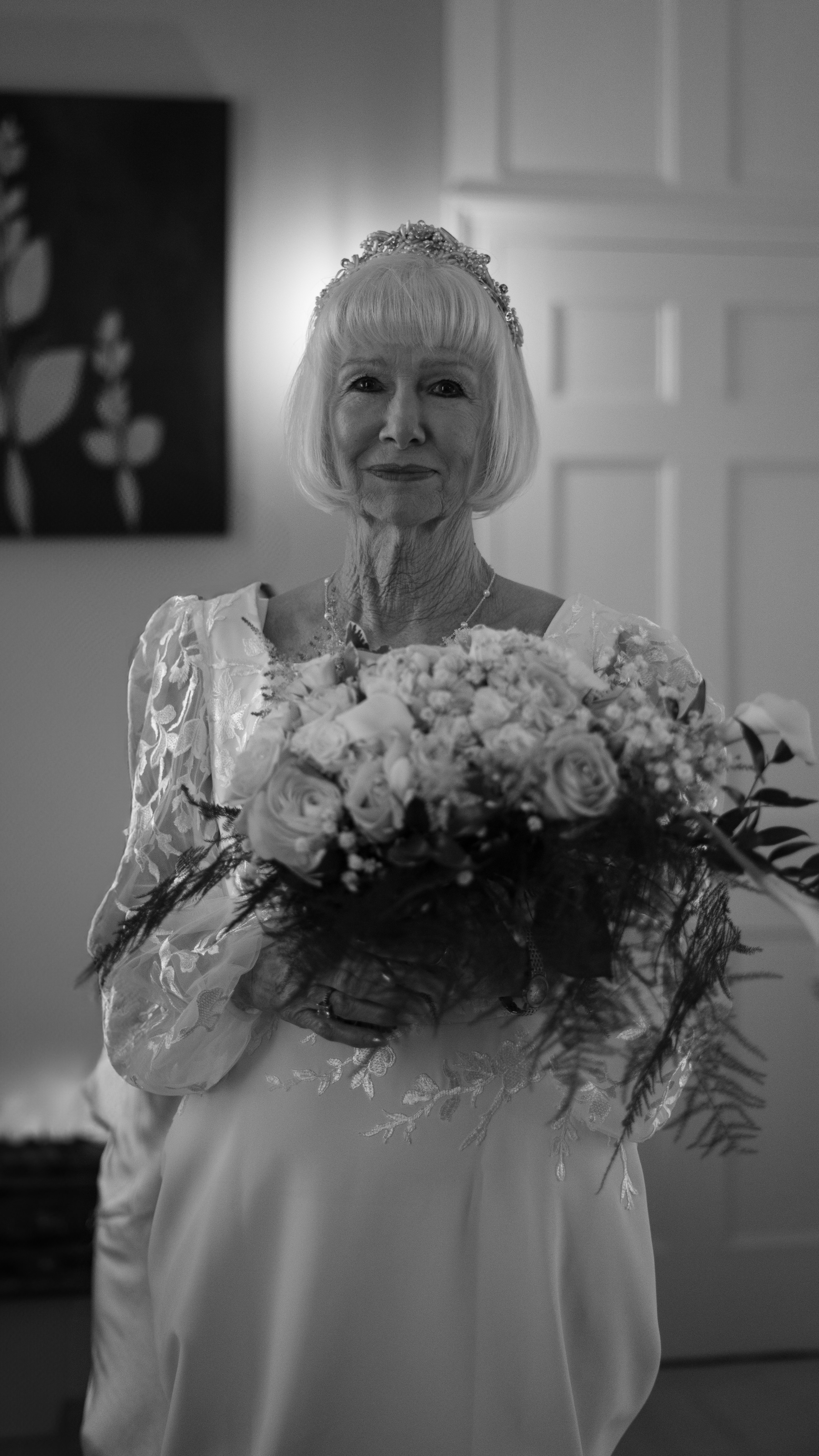 Elderly bride holding a bouquet of flowers