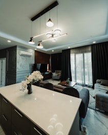 Modern living room with stylish furniture and lighting.