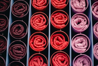 Rolled fabrics in shades of red and pink