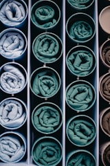 Rolled fabric samples in circular containers