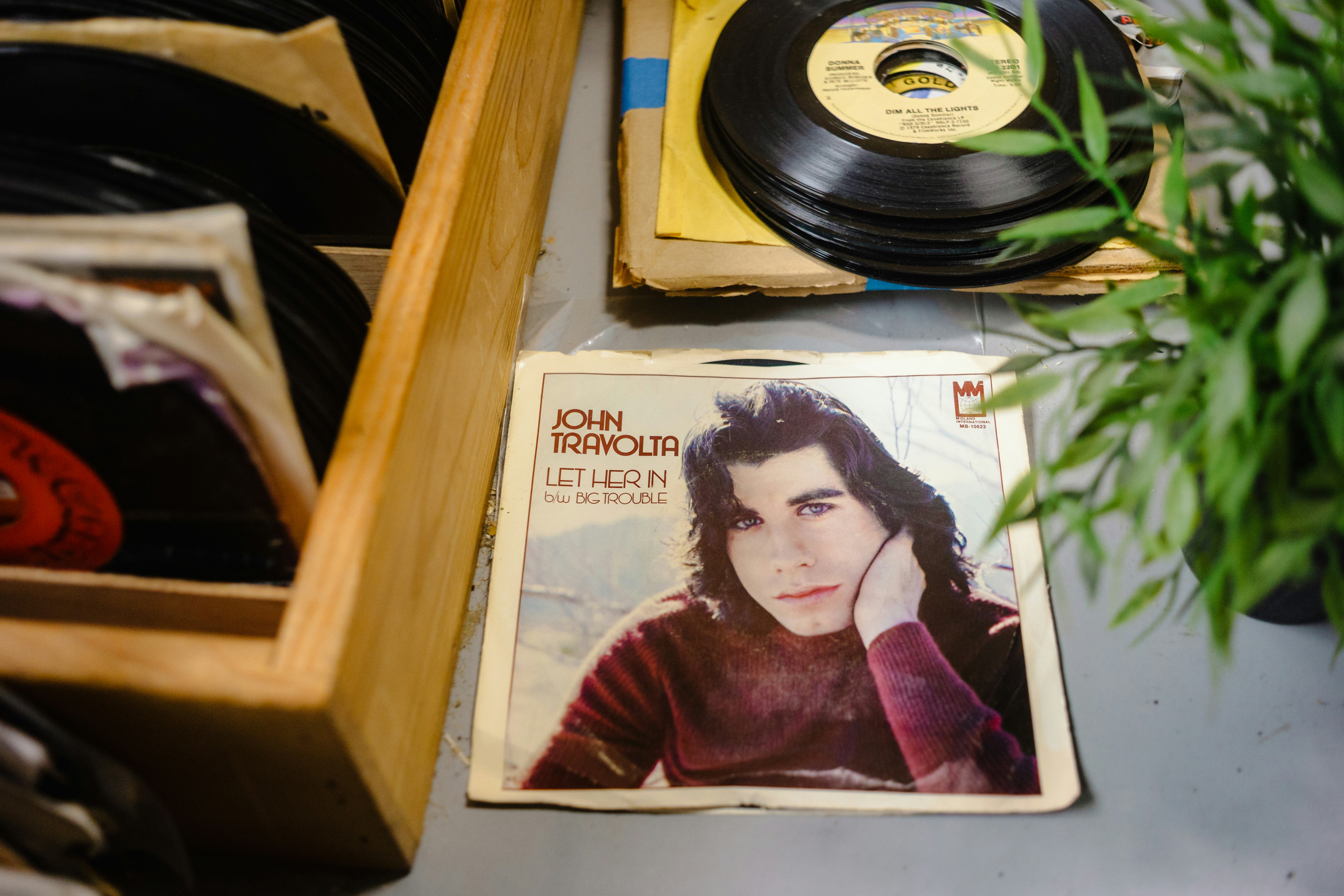 John travolta album cover with vinyl records
