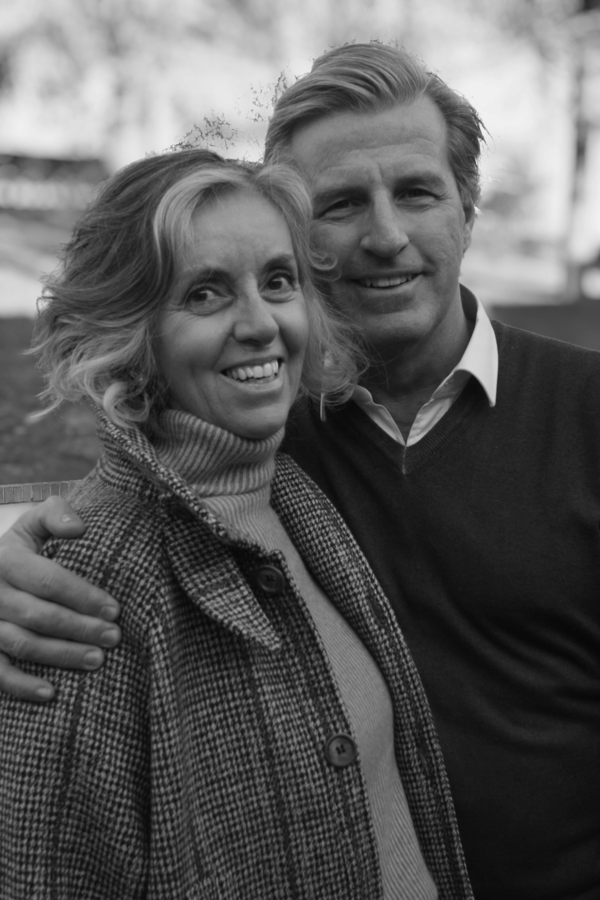 An older couple smiling together outdoors