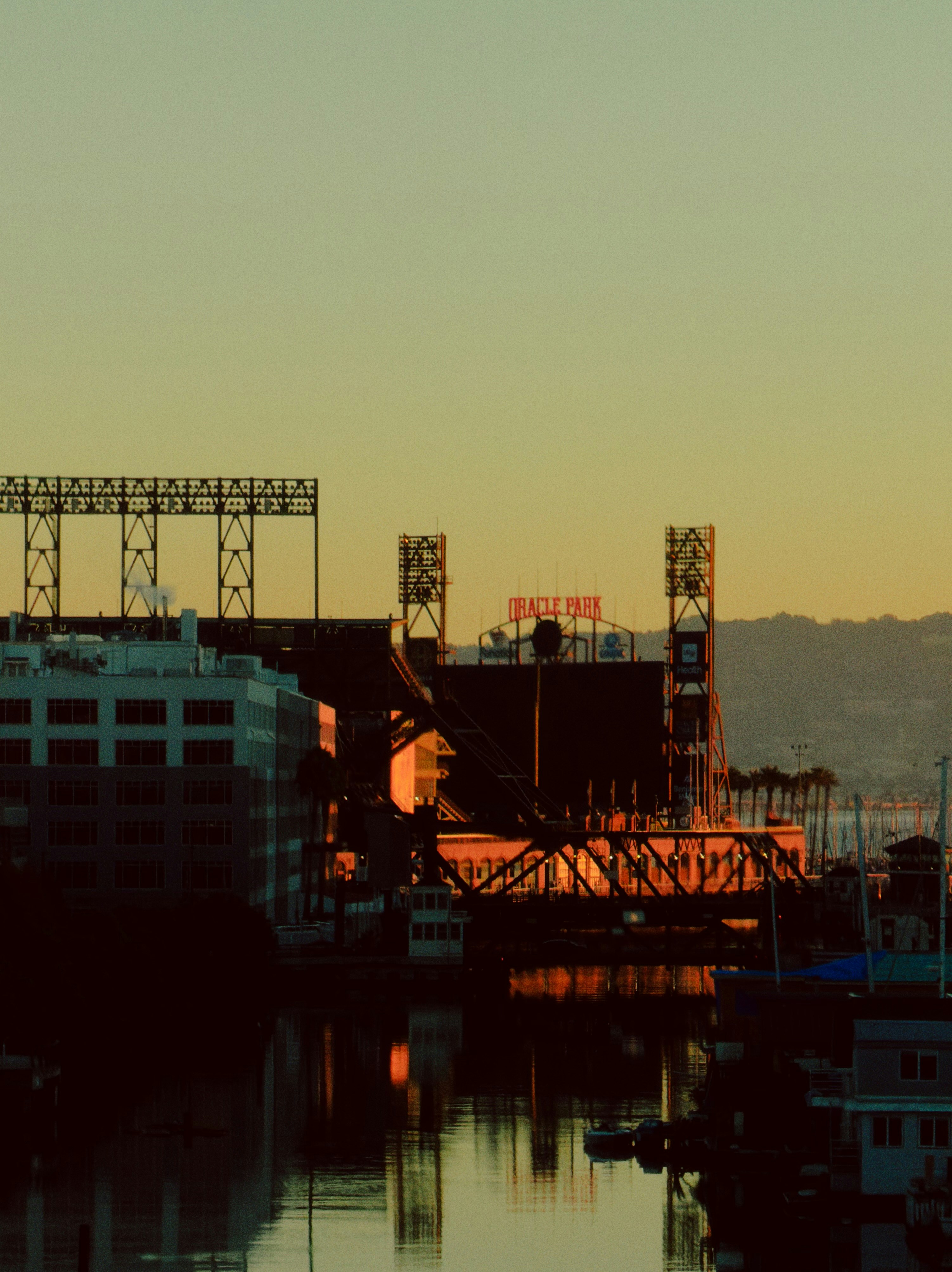 Stadium at sunset reflecting on the water