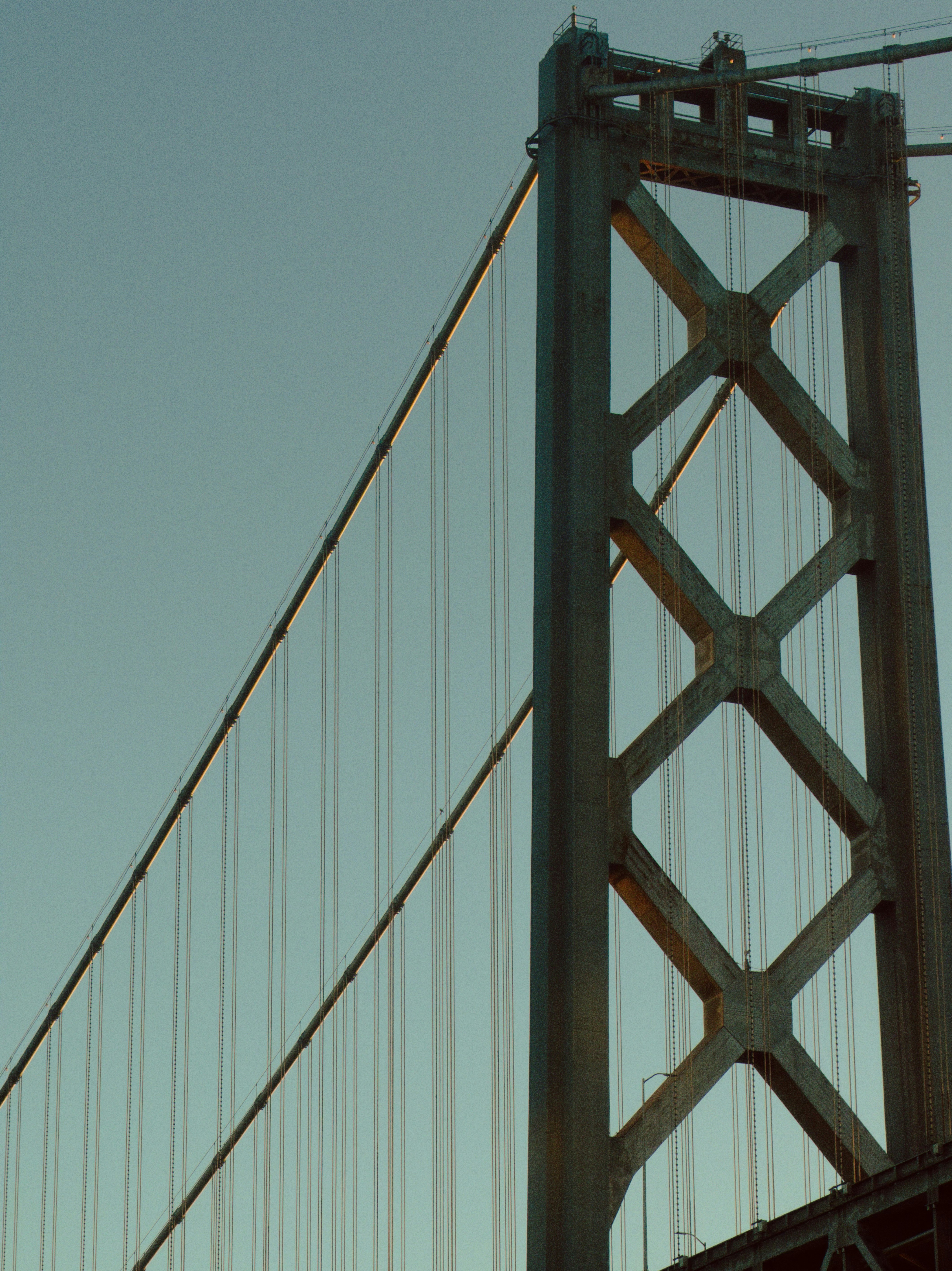 Detail of a suspension bridge tower and cables