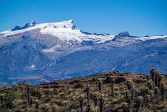 Snow-capped mountain range under a clear blue sky