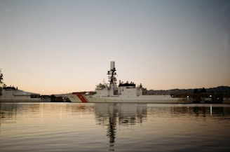 Coast guard ship docked in harbor at dusk