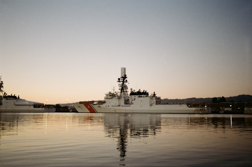 Coast guard ship docked in harbor at dusk