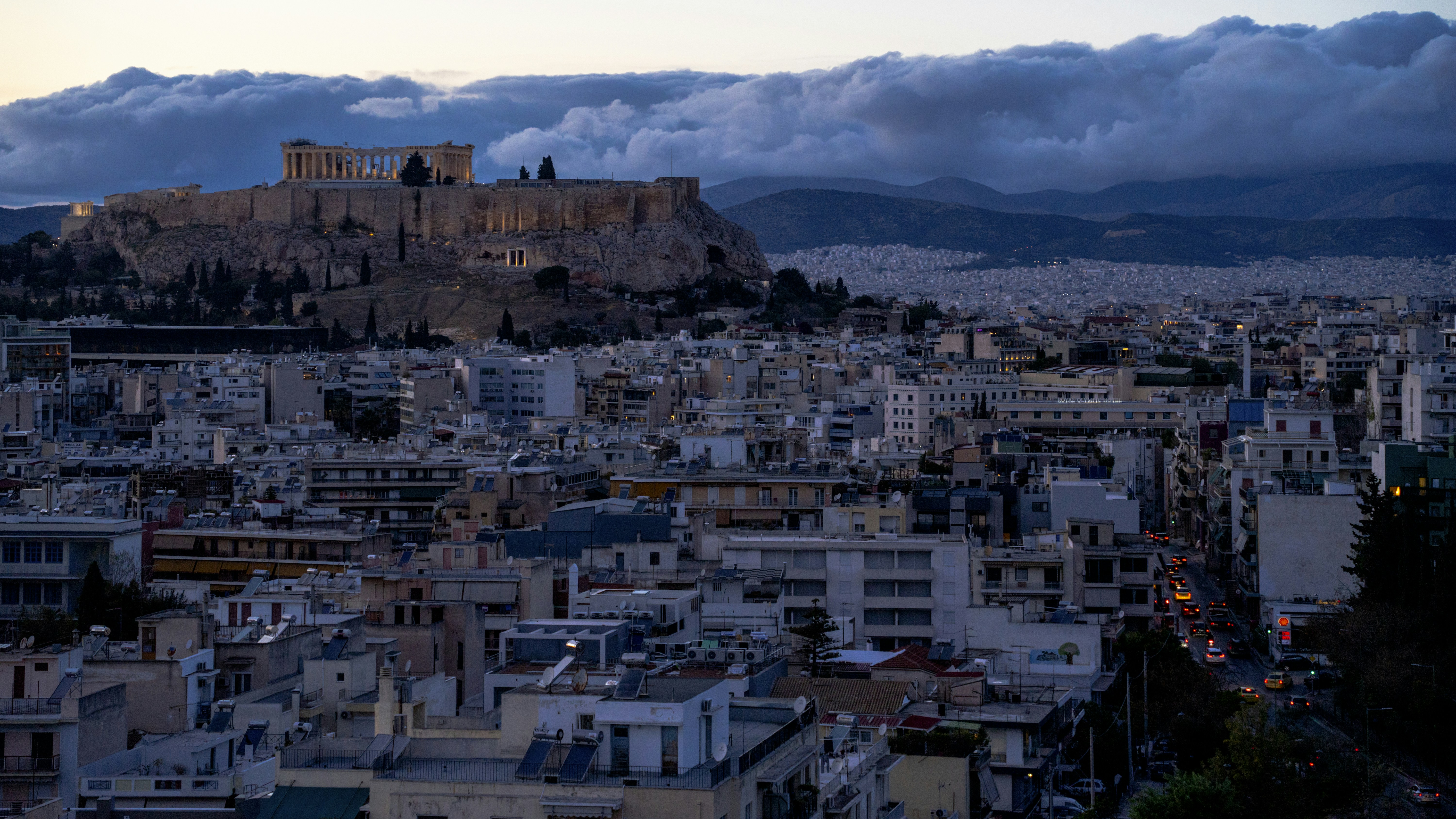 Ancient acropolis overlooking athens at dusk