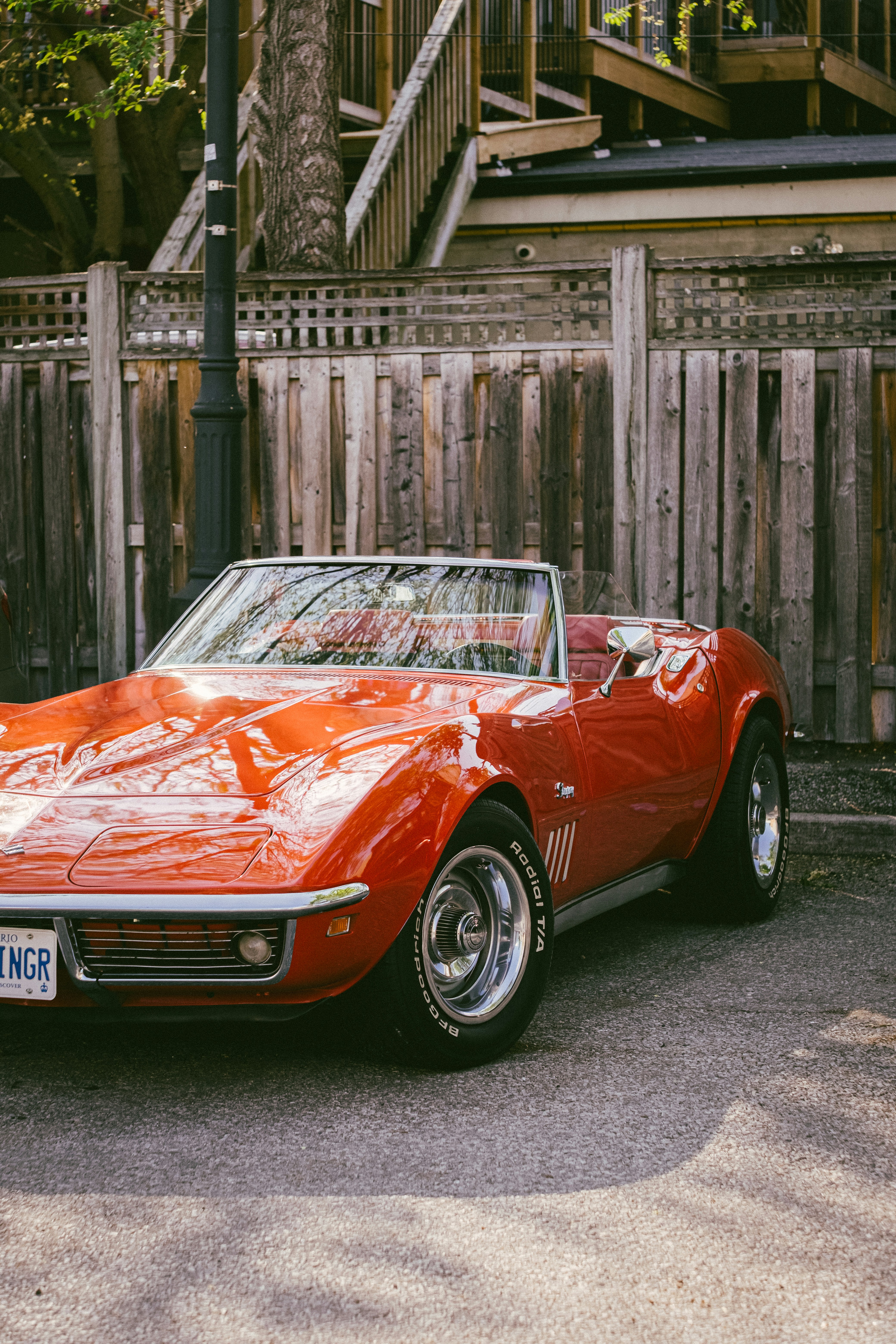 Red vintage convertible car parked outdoors