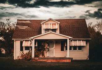 Old abandoned house under a stormy sky
