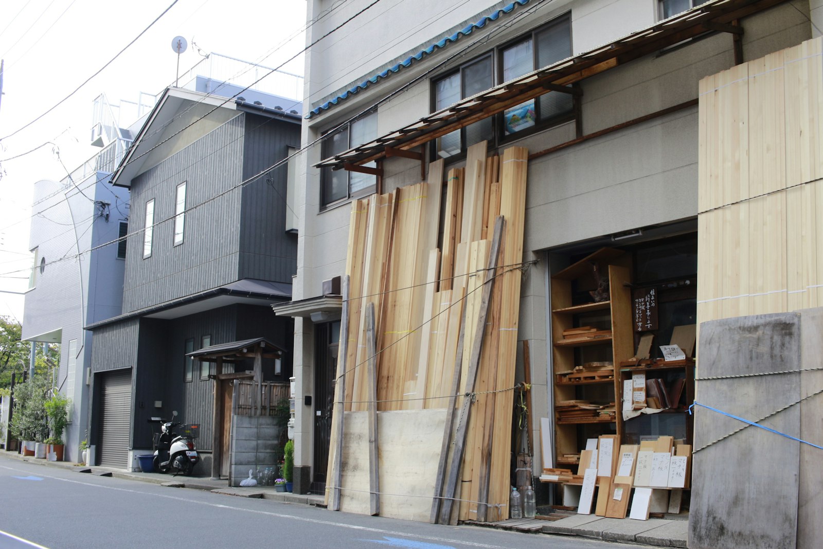 Stacked timber and plywood at an industrial yard