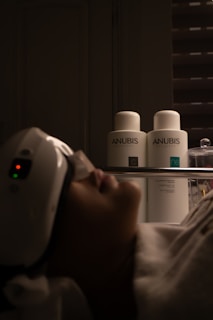 Woman receiving facial treatment with beauty products