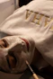 Woman receiving a facial treatment with a brush
