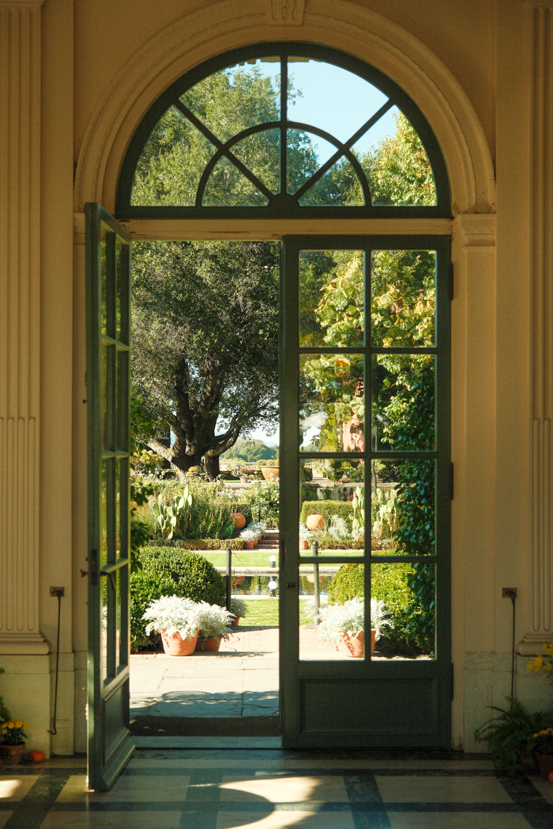 Indoor event space opening to outdoor garden