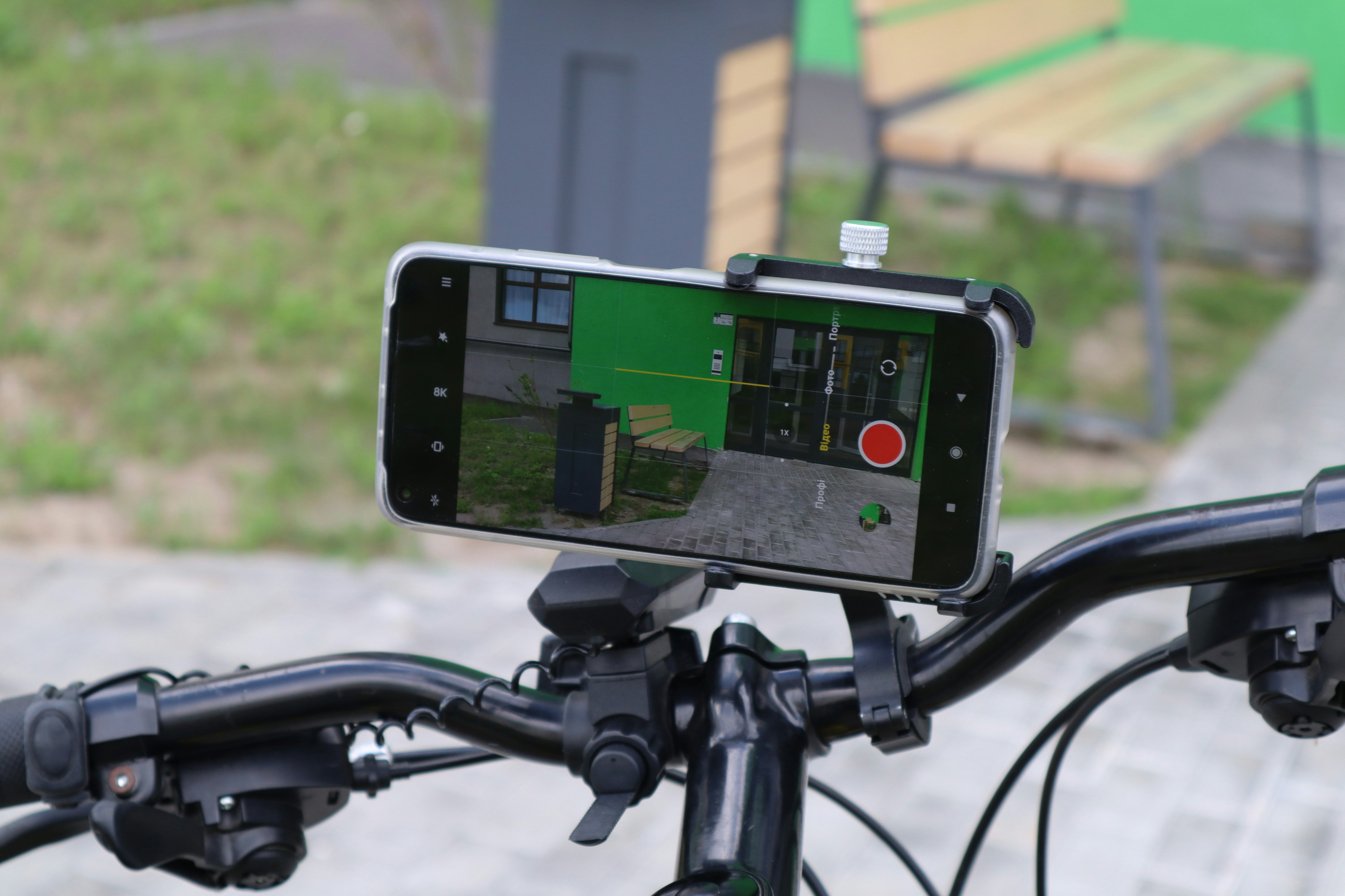 Smartphone mounted on bicycle handlebars recording video
