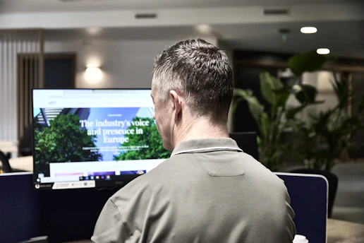 Man working on a computer in an office.