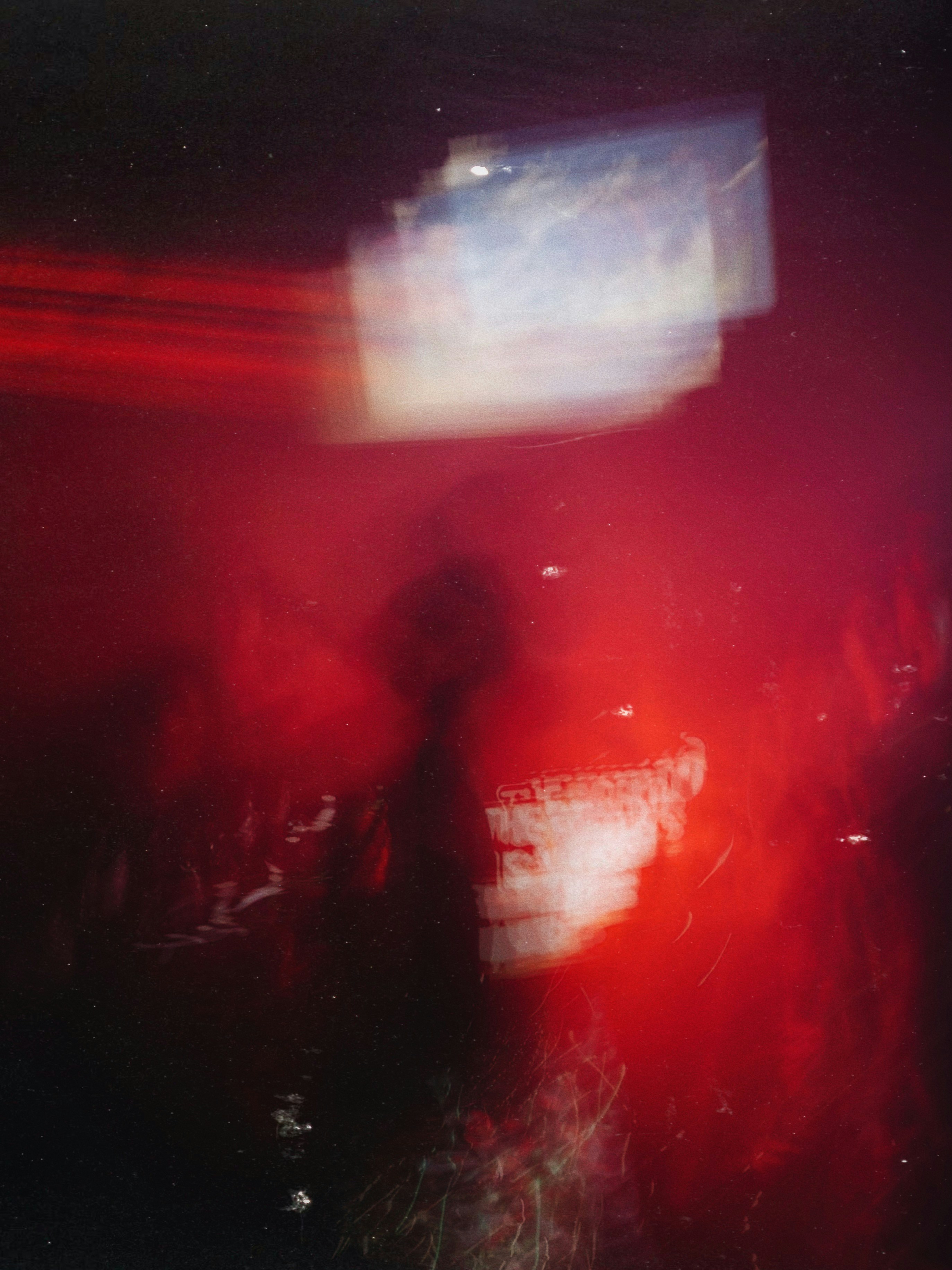 Abstract red and white light streaks at night