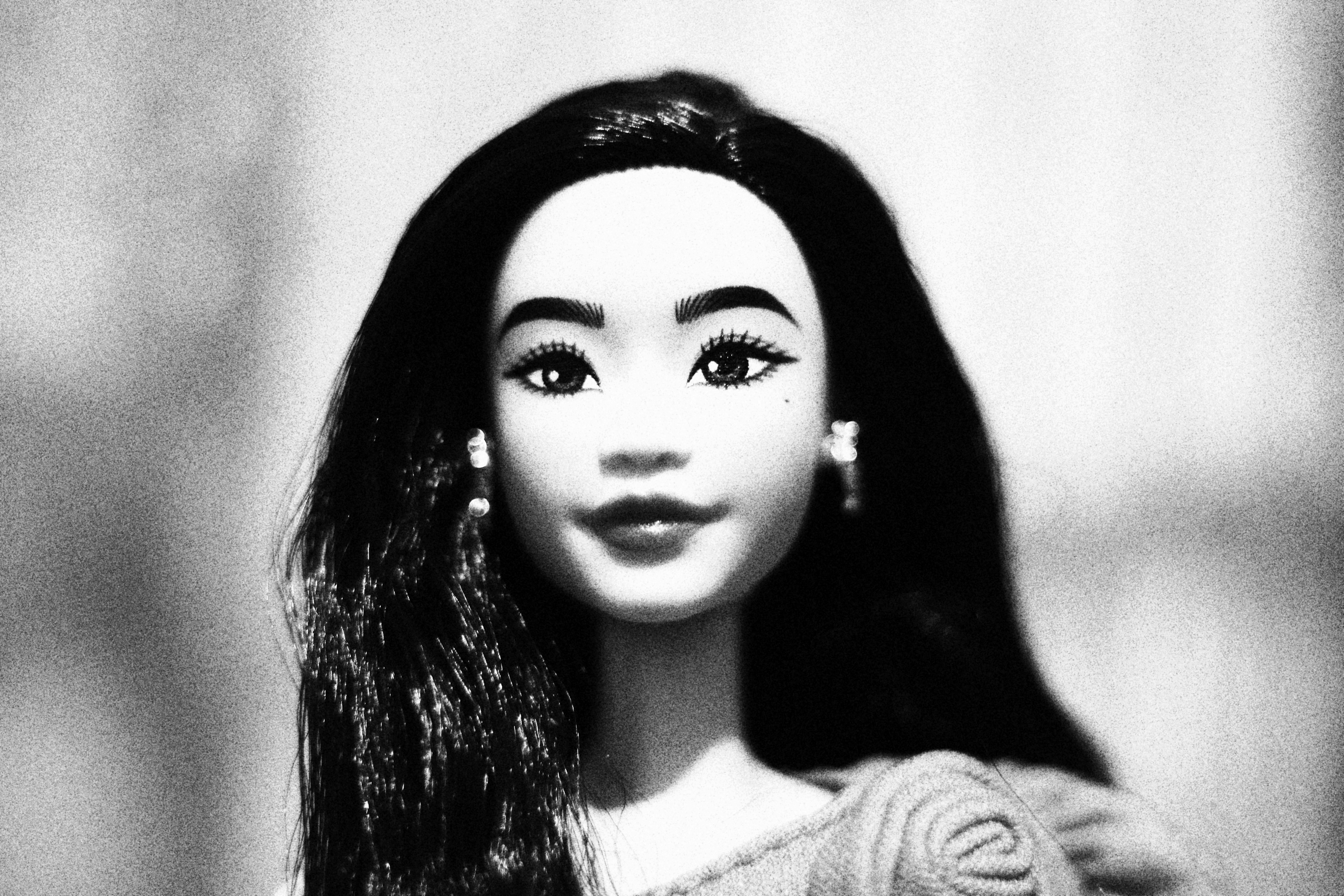 Black and white portrait of a doll.
