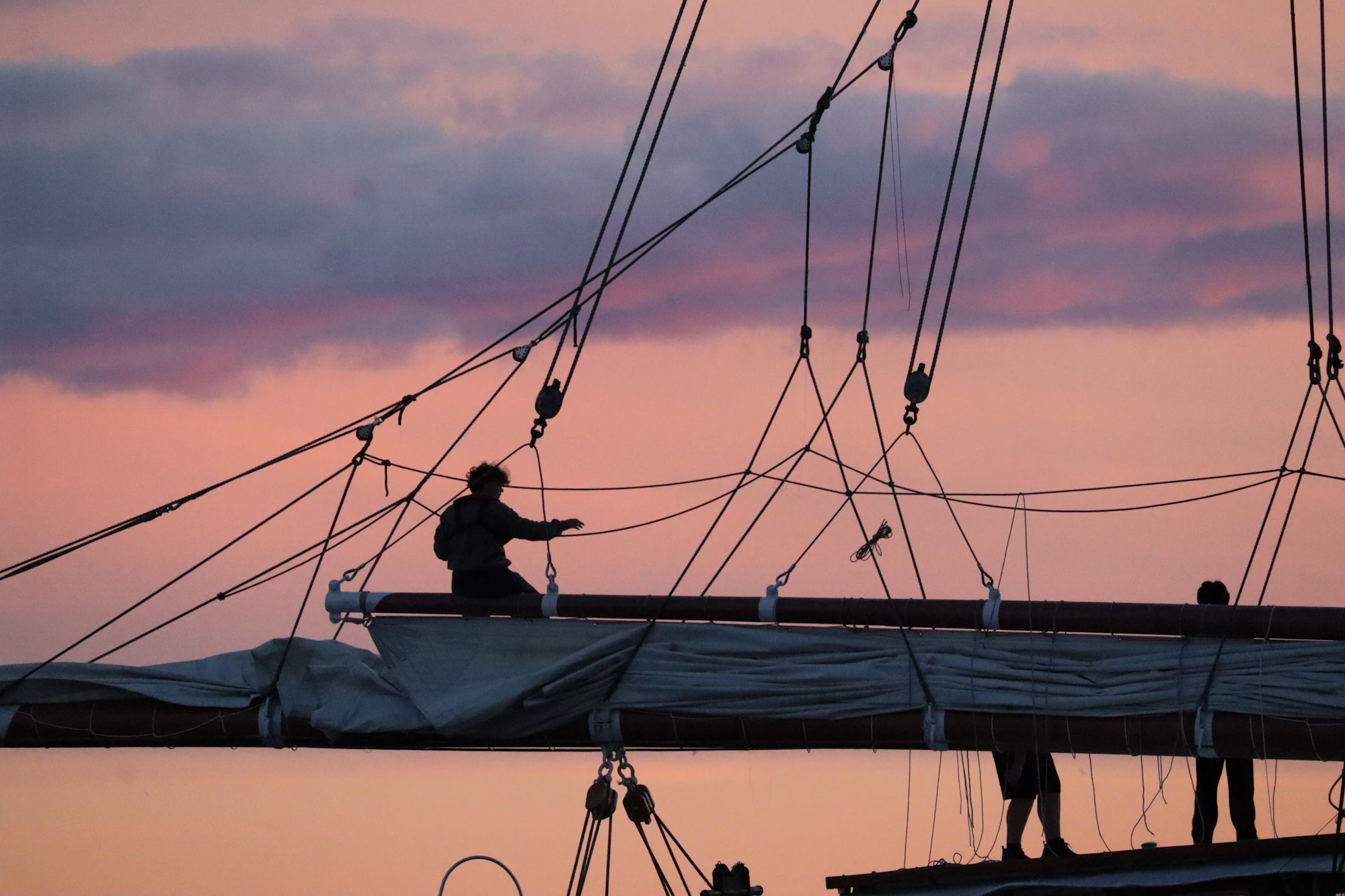 Seafarer on deck at sunset