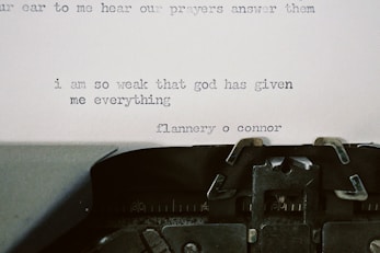 Typewriter with quote by flannery o'connor.