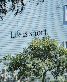 Life is short. text on a building