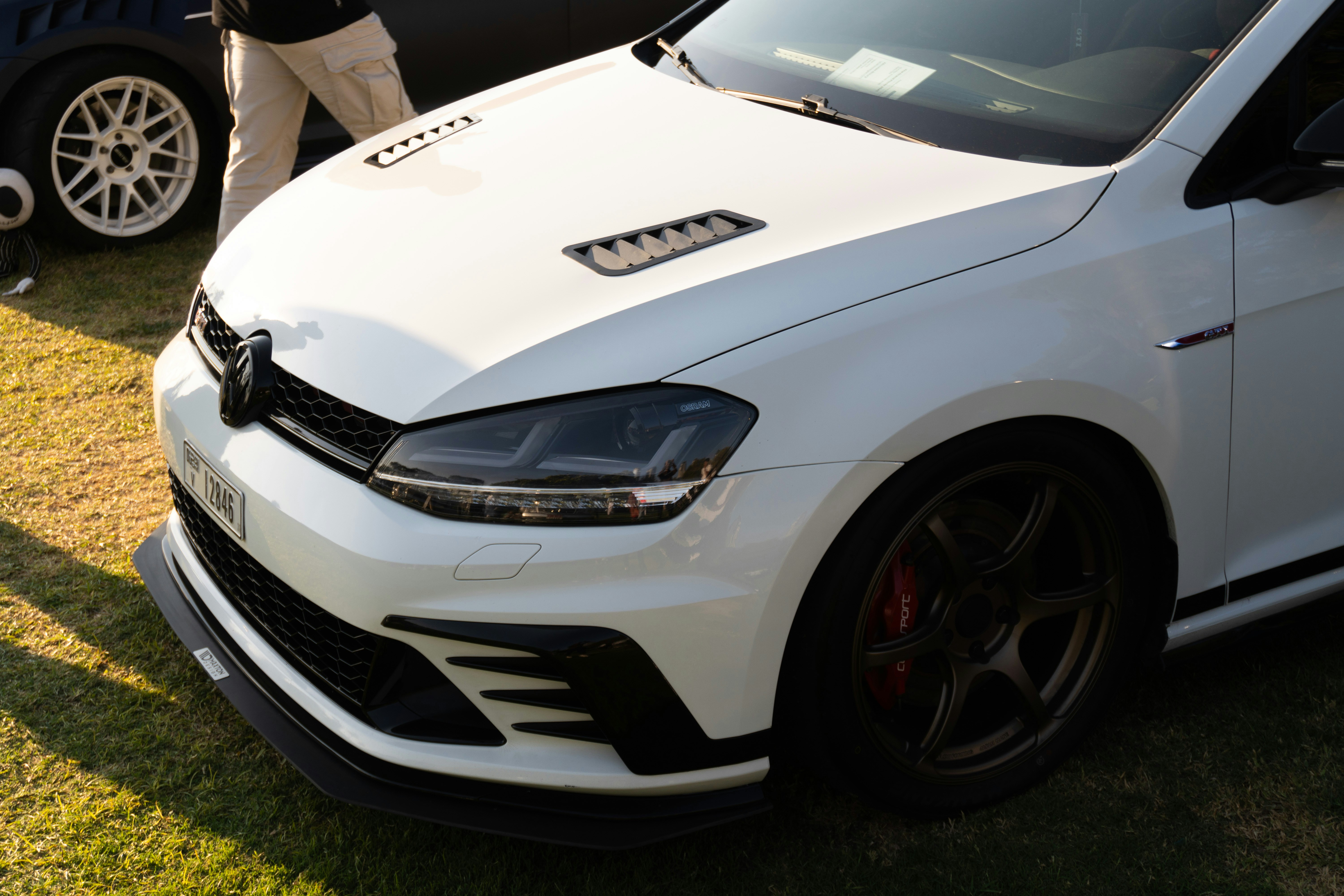 White performance hatchback car with sporty details