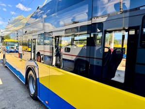 Yellow and blue bus with reflections on-board reflections