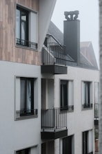 Modern building facade with balconies and windows.