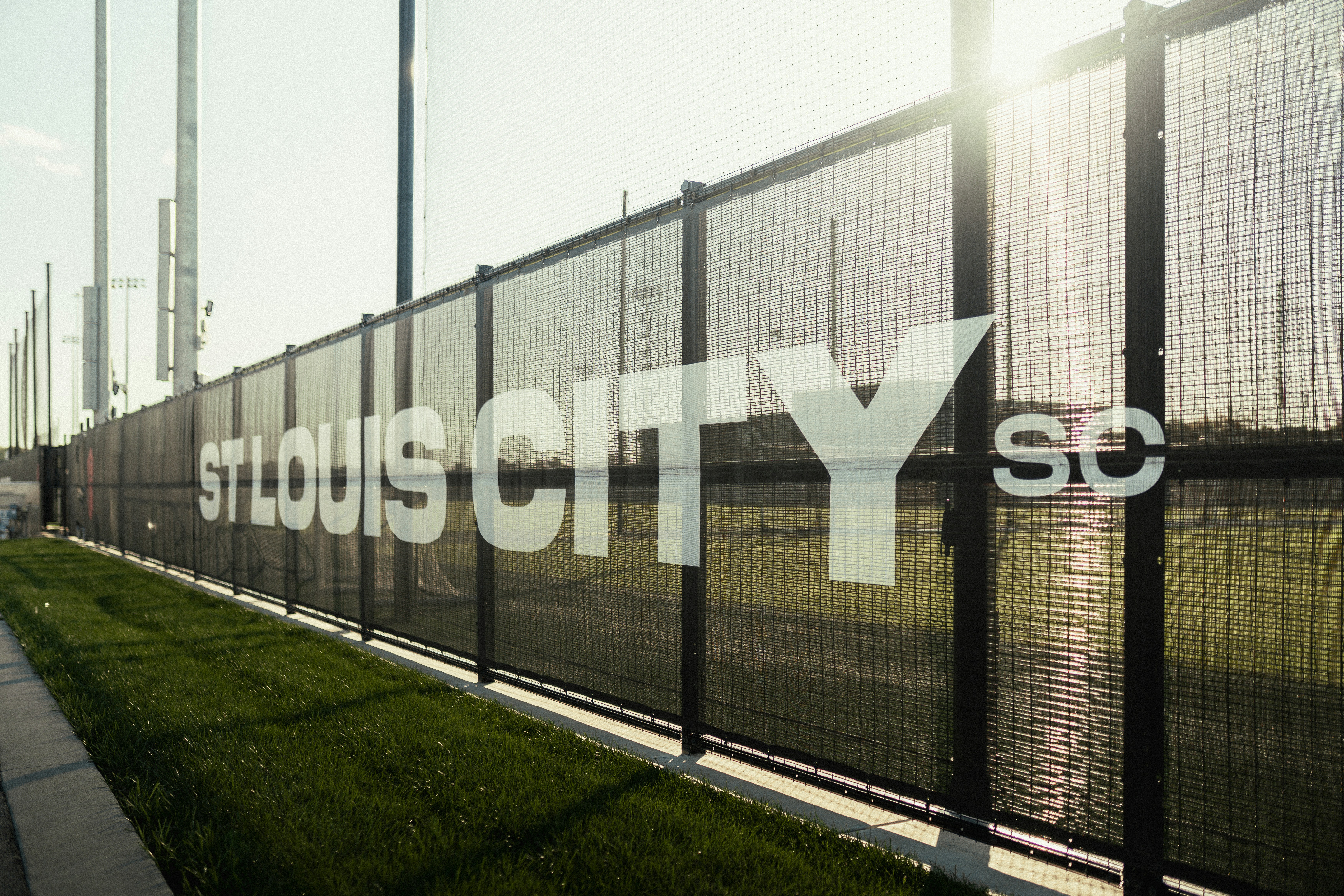 Missouri ballpark fence and stands at dusk
