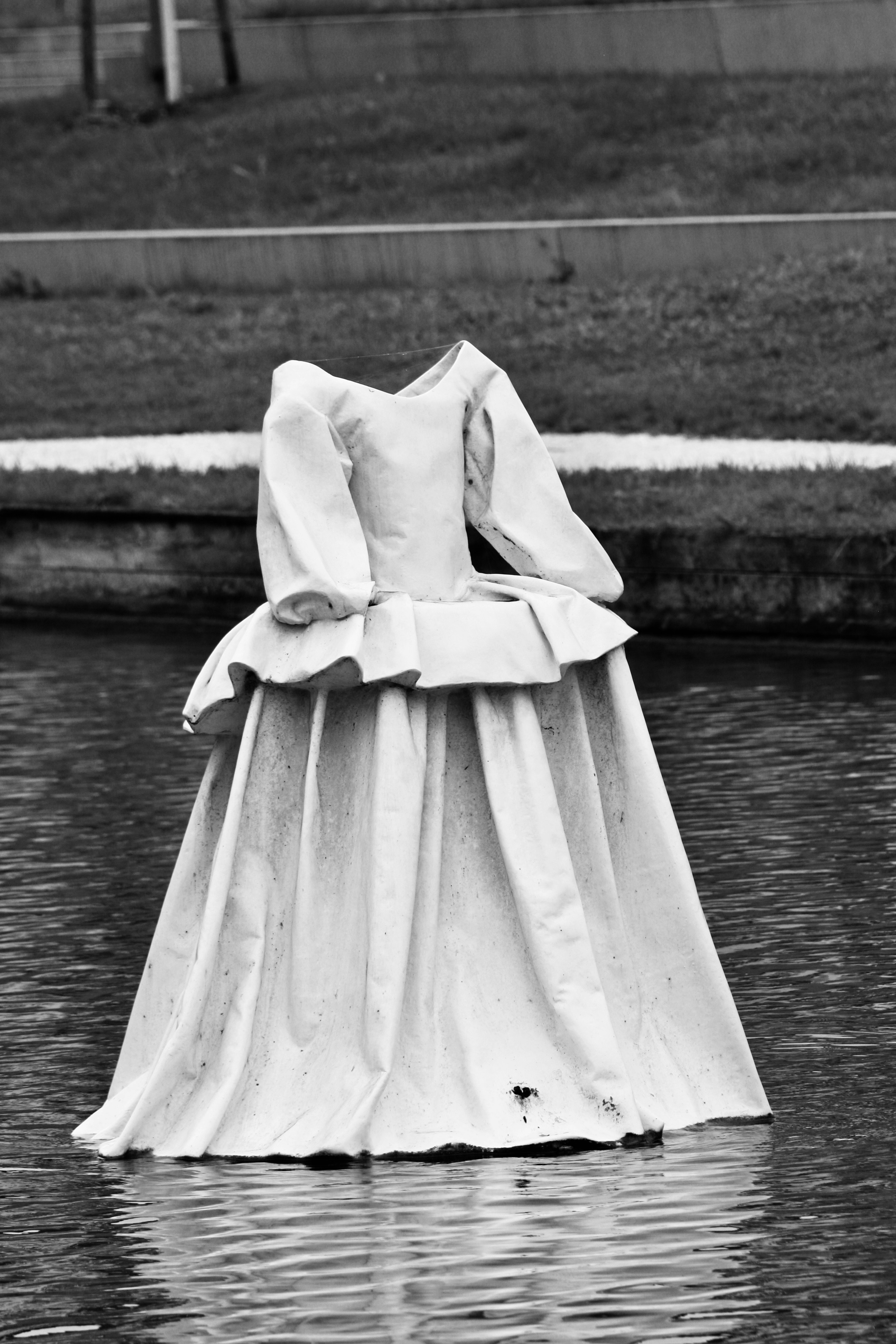 A white dress floats on water