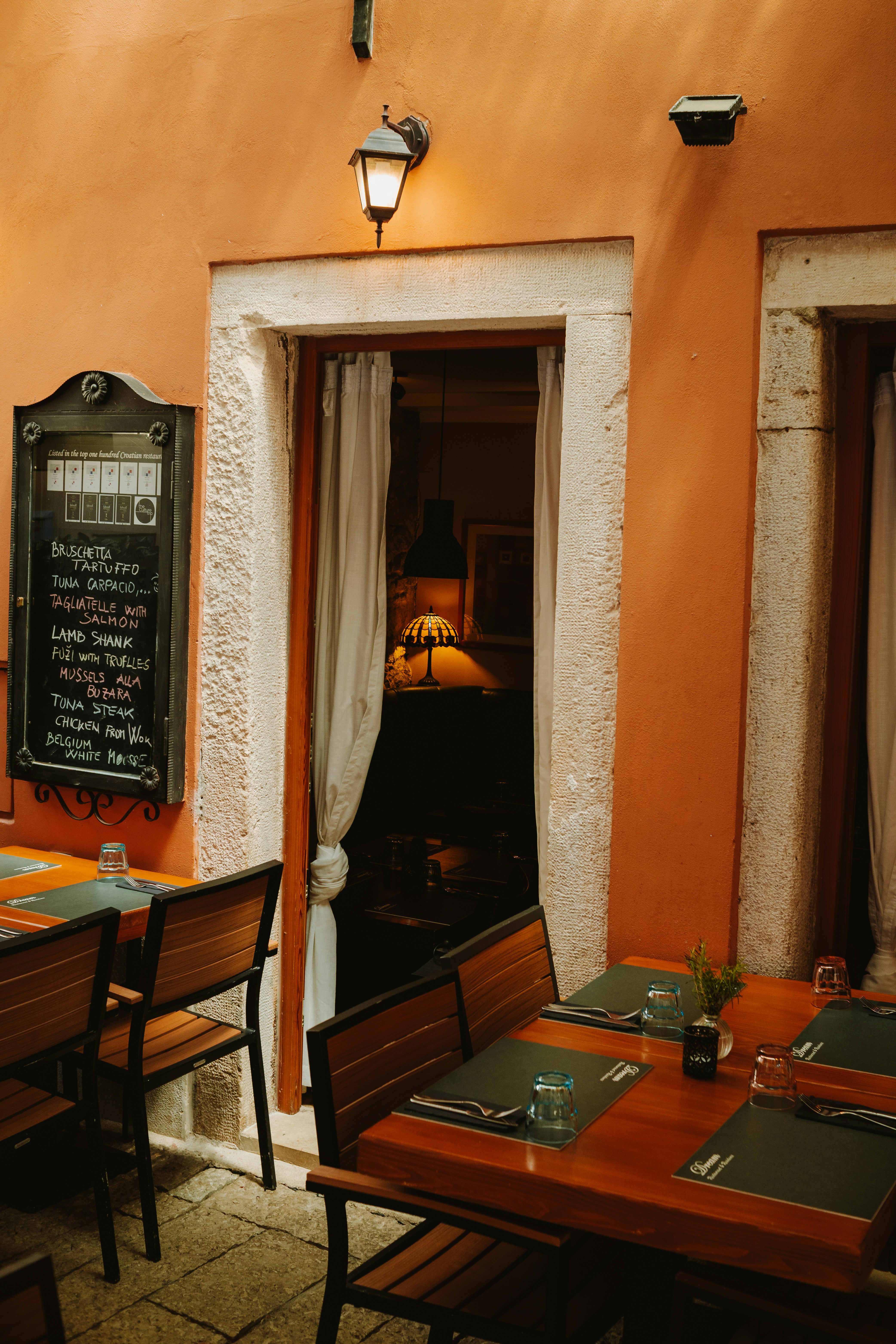 Outdoor restaurant tables set for dining