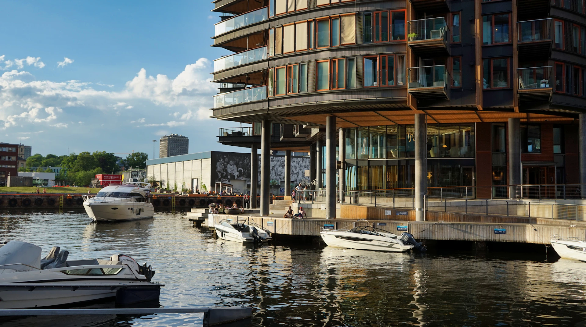 Modern building overlooking a harbor with boats
